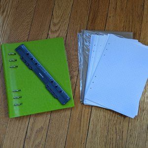 Filofax A5 6 ring clipbook with various types of paper
